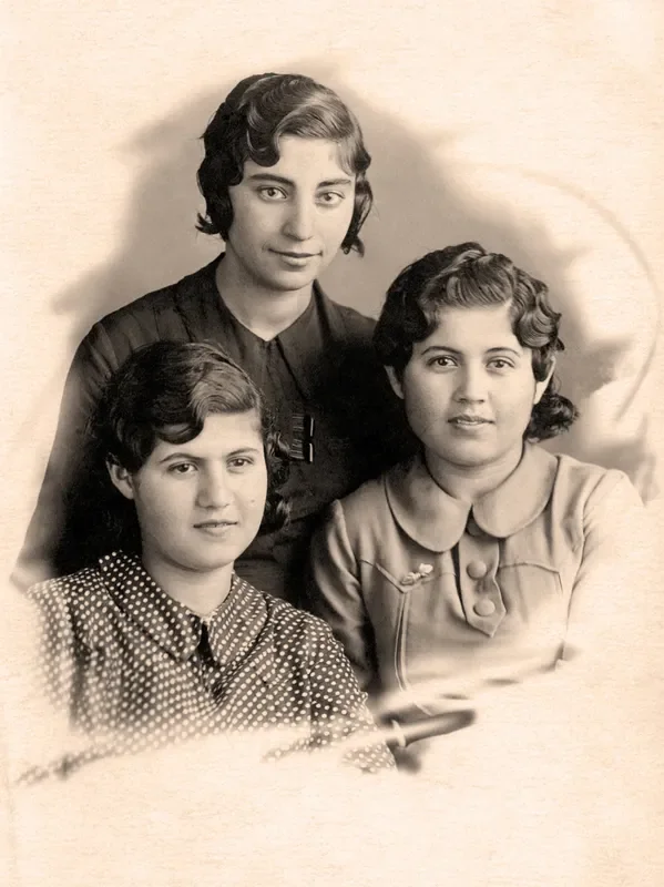 An elderly person looking at an old family photo, symbolizing memories and family documentation